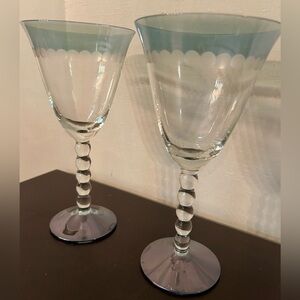 2 Diane Design wine glasses. Frosted etchings w/tinted  glass rim. 8.25” Aqua